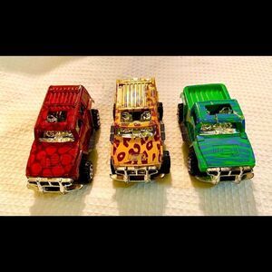 Vintage Lot Of 3 Toy 4 X 4 Trucks W Animal Prints Good Condition Unbranded.